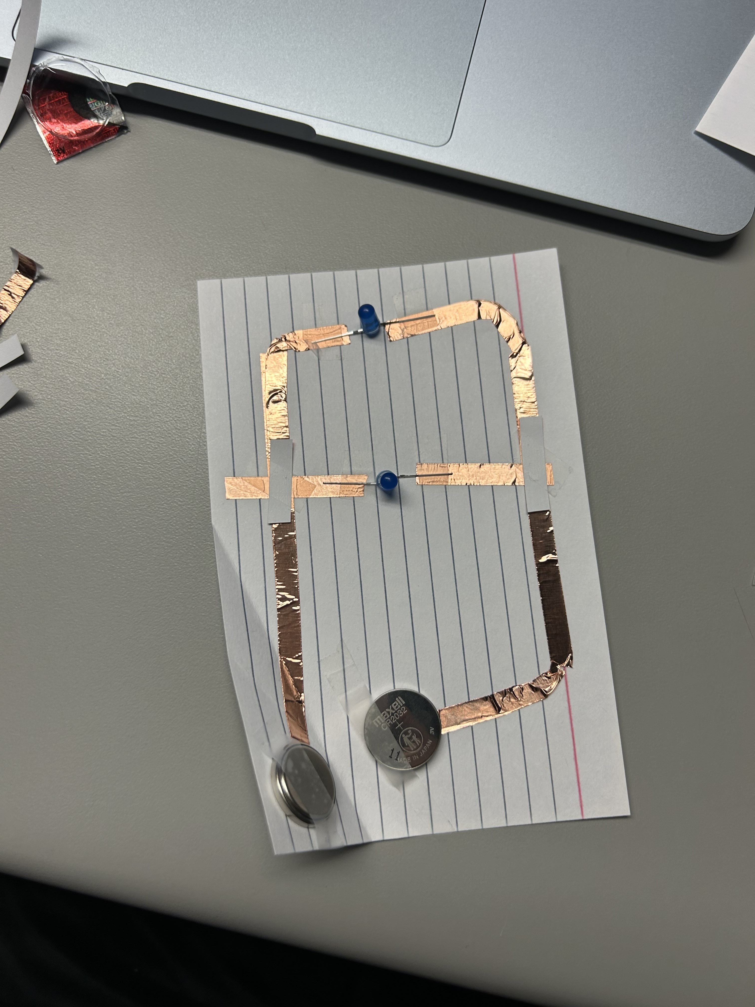 I went onto the parallel circuit here, and decided to bend the tape instead of taping on the flip side of the conductive tape to make the corners connect, but something was still wrong with it.