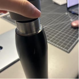 This is the cap of my water bottle being twisted off.