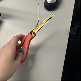 This is a pair of scissors when it's closed, and the light being on.