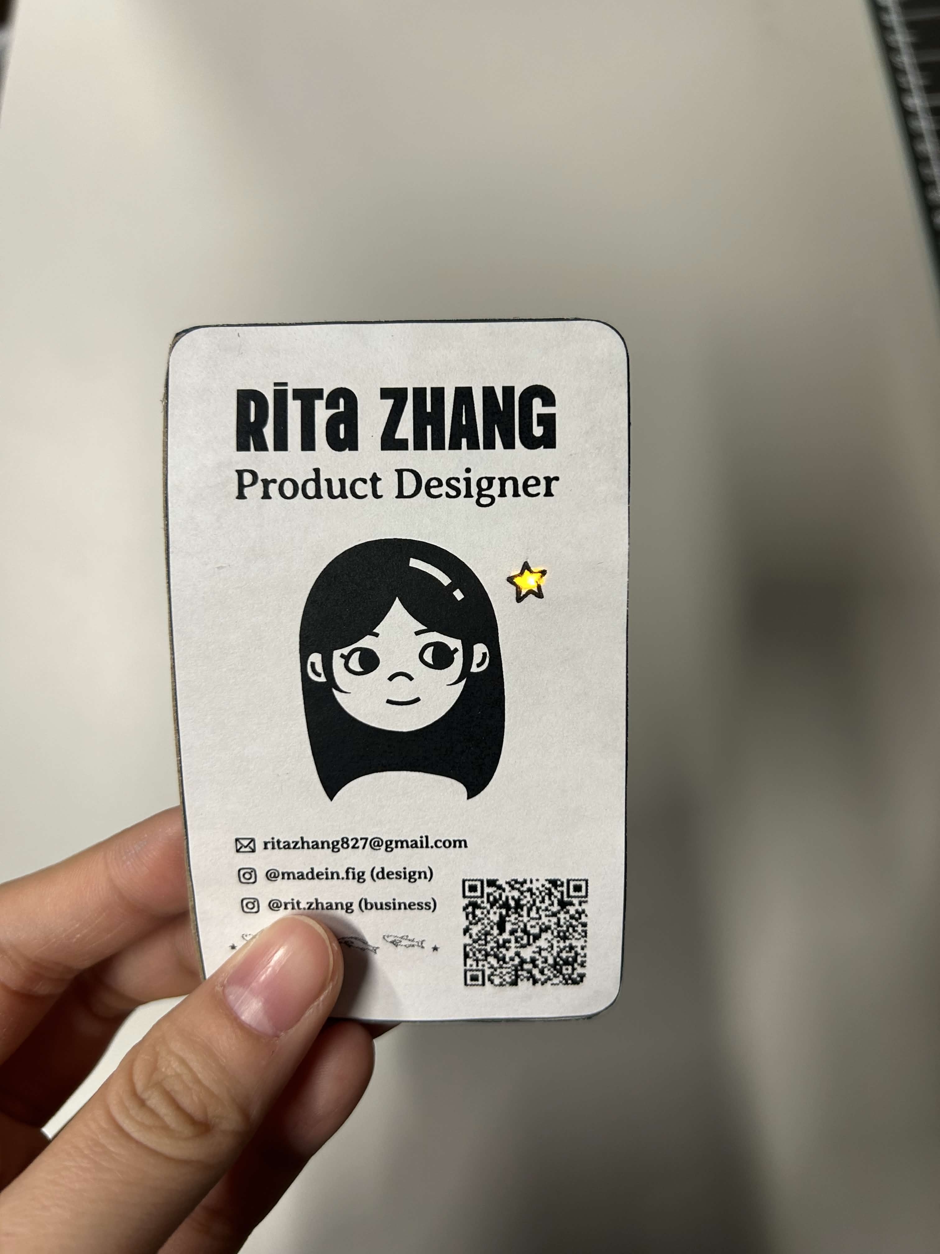 On the back of the business card, there's a mini switch where you can pull it up and down for the star to light up.