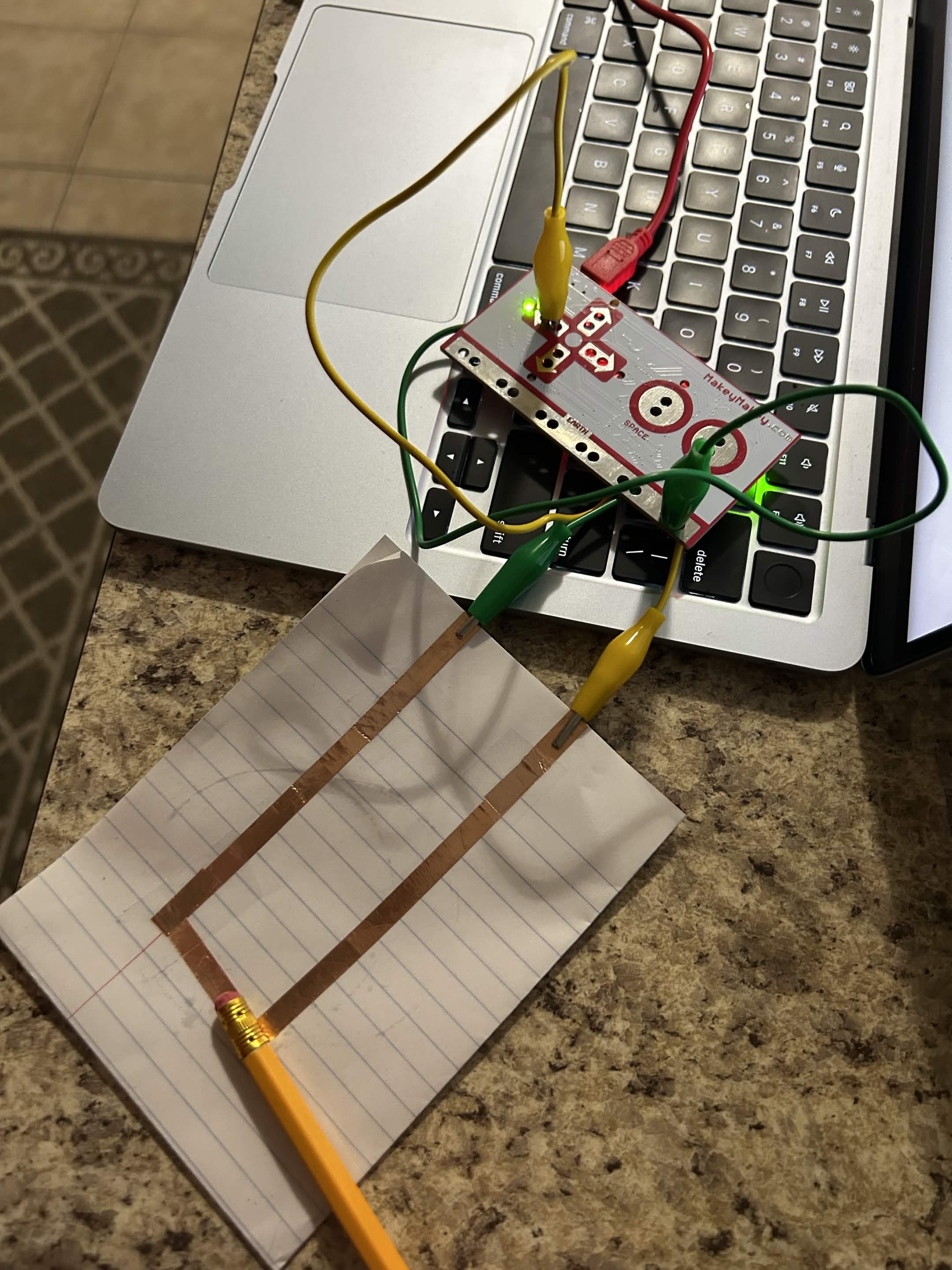 I closed the circuit with the metal part of a pencil.