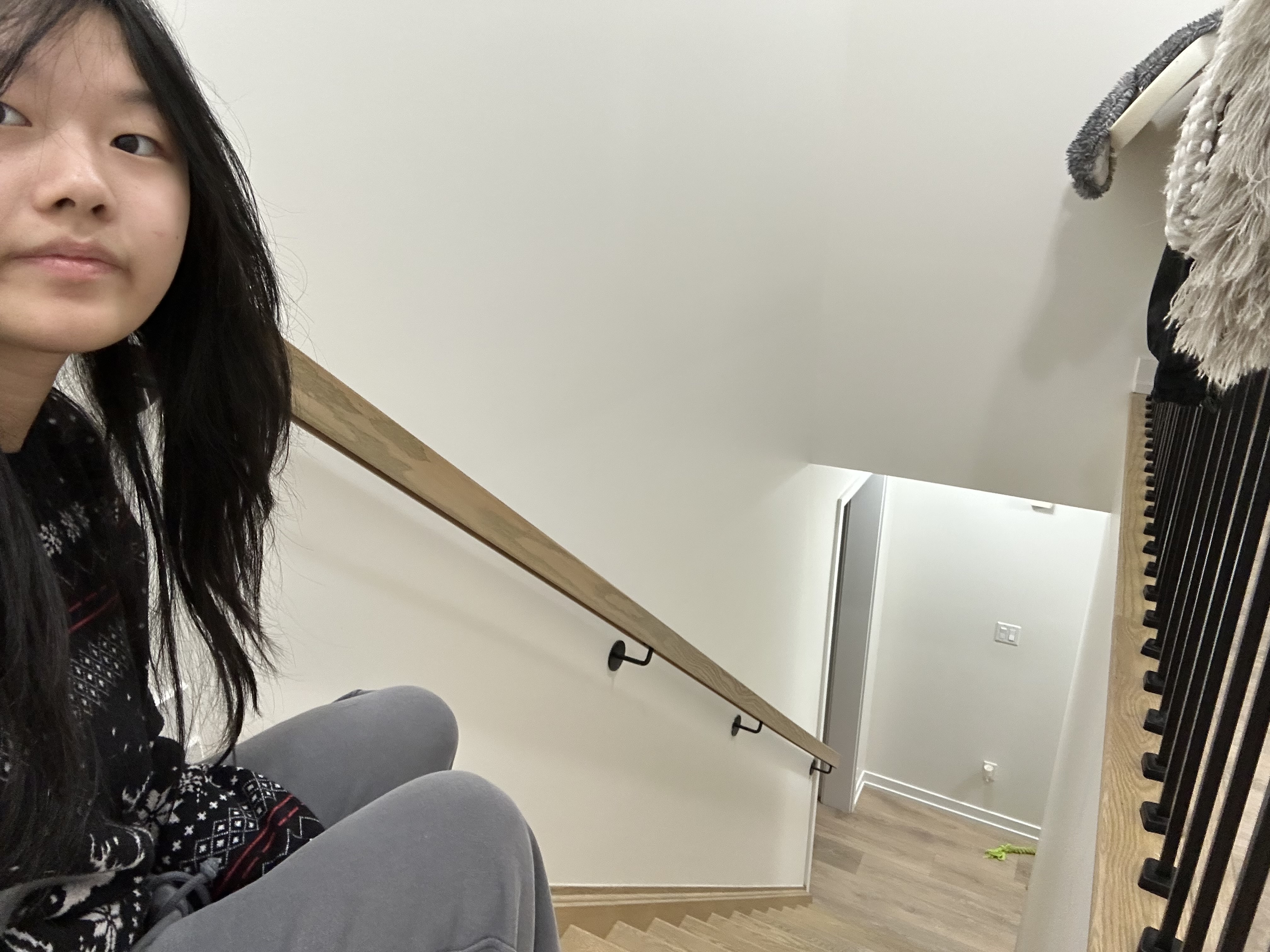 This is a photo of me next to the stair case, and I notice it's very narrow, and the building doesn't have any elevators which isn't very accessible for people with limited mobility.