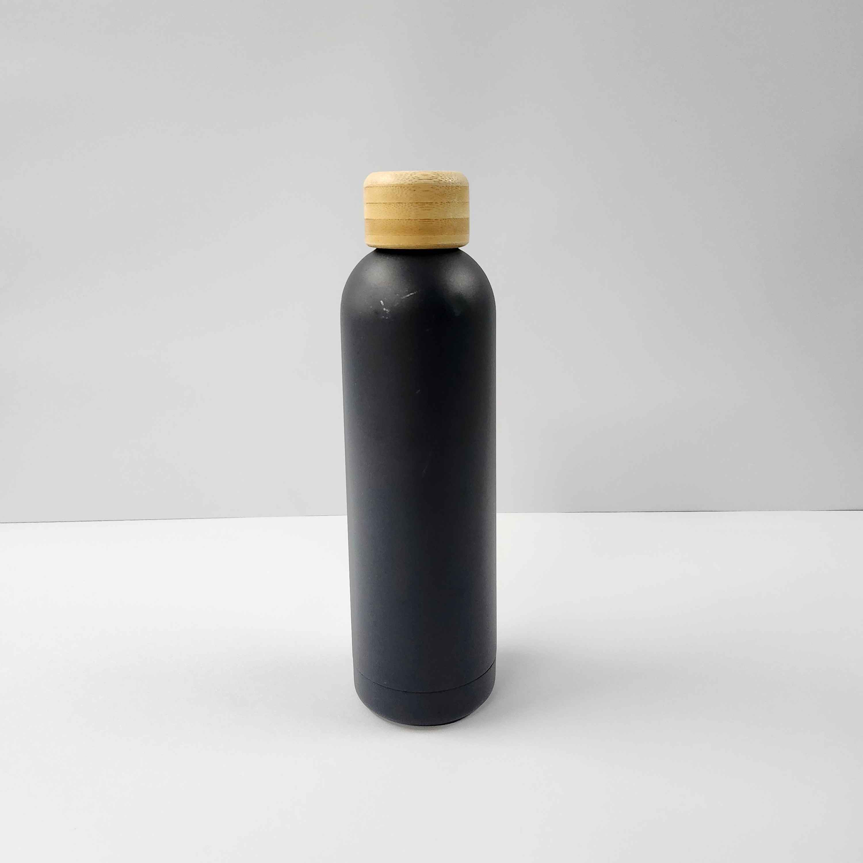 I used two big sheets of paper as my background setup, and this is my water bottle from a front view, which is a part of my simple objects.